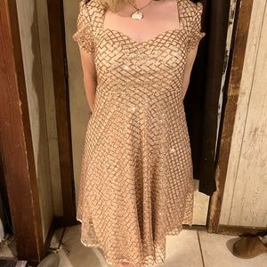 Golden Sequins knee length dress.